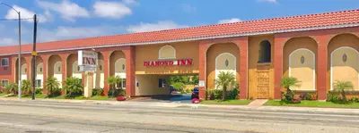 a large brick building on the side of a street at Diamond Inn in Inglewood