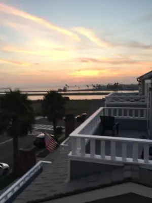 a view from the balcony of a house with an american flag at 