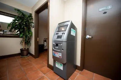 a atm machine in a hallway next to a door at Casa Bella Inn- Huntington Park in Huntington Park