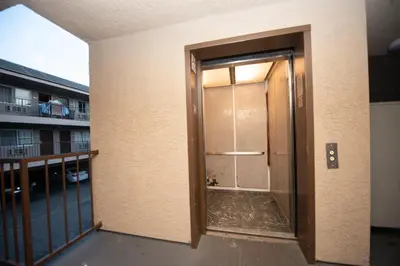 an open door in a building with a balcony at Casa Bella Inn- Huntington Park in Huntington Park