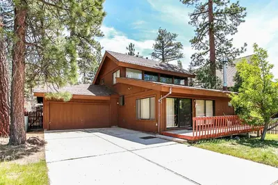 a house with a porch and a fence at Lakeview Fishing House-121 by Big Bear Vacations in Big Bear Lake