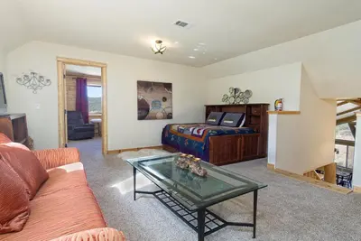 a living room with a bed and a coffee table at Eagle Ridge Views-1648 by Big Bear Vacations in Big Bear Lake