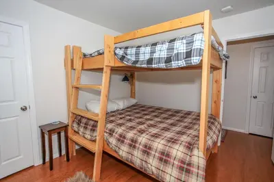 a bedroom with two bunk beds in a room at Mountain Modern-1743 by Big Bear Vacations in Big Bear Lake