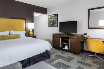 a hotel room with a bed and a flat screen tv at Hampton Inn & Suites Los Angeles/Hollywood, CA in Los Angeles