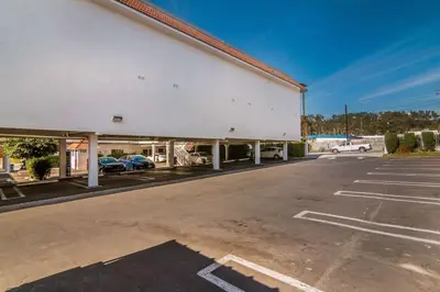 an empty parking lot in front of a building at Motel 6 Monterey Park in Monterey Park