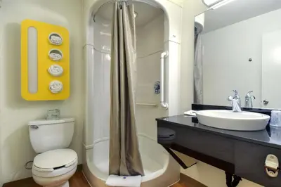 a bathroom with a toilet and a sink and a shower at Motel 6-Westminster, CA - South - Long Beach Area in Westminster