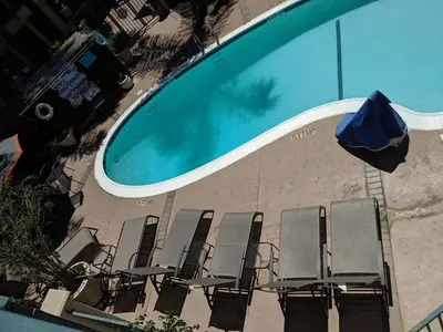 an overhead view of chairs and a swimming pool at Tarzana Inn in Tarzana