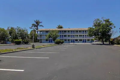 an empty parking lot in front of a building at Motel 6-Carpinteria, CA - Santa Barbara - North in Carpinteria