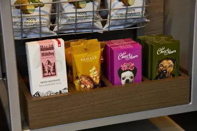 a shelf filled with different types of snacks at AC Hotel by Marriott Beverly Hills in Los Angeles