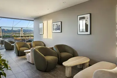a waiting room with chairs and a table at AC Hotel by Marriott Beverly Hills in Los Angeles