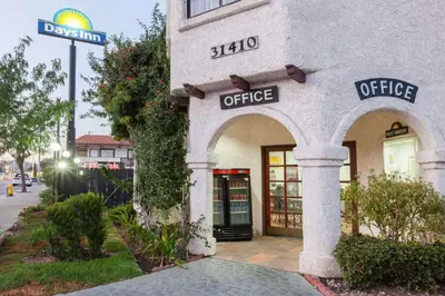 a office building with a sign that reads office at Days Inn by Wyndham Castaic Six Flags Magic Mountain in Castaic