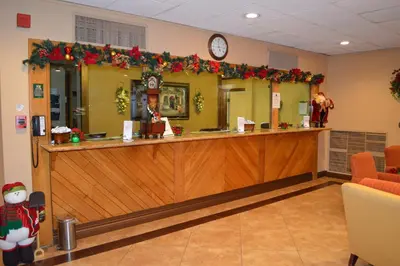 a lobby with a christmas decoration on the counter at Ontario Airport Inn in Ontario