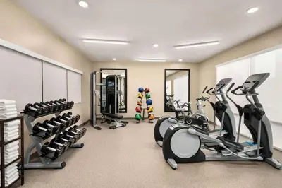 a fitness room with treadmills and cardio machines at La Quinta Inn & Suites by Wyndham San Bernardino in San Bernardino