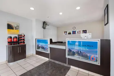 a waiting room with a large tv in a store at Motel 6-Santa Ana, CA in Santa Ana