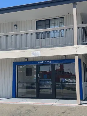 a view of the entrance to a building with a welcome entrance at Motel 6-Santa Ana, CA in Santa Ana
