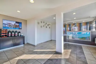 a lobby of a hotel with a pharmacy at Motel 6-Anaheim, CA - Fullerton East in Anaheim