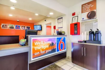 a fast food restaurant with a sign on the counter at Motel 6 Chino, CA - Los Angeles Ontario in Chino