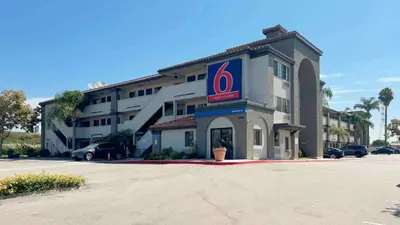 a hotel with a pepsi sign on the side of it at Motel 6-Bellflower, CA - Los Angeles in Bellflower