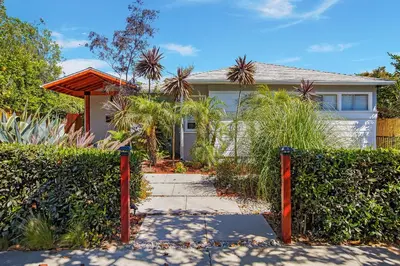 a house with a gate in front of it at Oasis with pool and music studio by BENVENU in Los Angeles