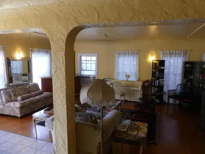 a living room with a couch and a table at Hotel del Flores in Los Angeles