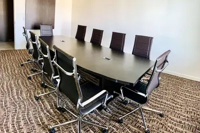 a conference room with a long table and chairs at Comfort Inn & Suites Near Ontario Airport in Ontario