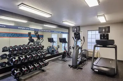 a gym with several treadmills and exercise bikes at Hampton Inn & Suites Hermosa Beach in Hermosa Beach