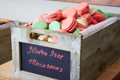 a wooden box filled with different colored macaroons at The Beverly Hilton in Los Angeles