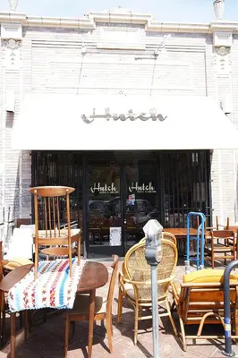 a group of chairs and a parking meter in front of a store at The Steady in Los Angeles
