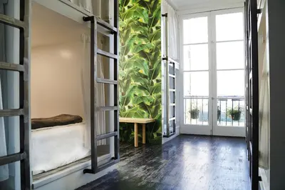 a room with a bed and a large window at The Steady in Los Angeles