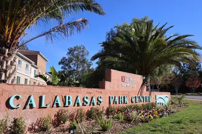 a sign for calabasas park centre with palm trees at Hilton Garden Inn Calabasas in Calabasas