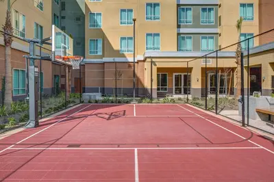 a basketball court in front of a building at Residence Inn by Marriott Ontario Rancho Cucamonga in Rancho Cucamonga