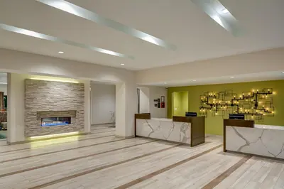 a lobby with a fireplace and a waiting room at Residence Inn by Marriott Ontario Rancho Cucamonga in Rancho Cucamonga
