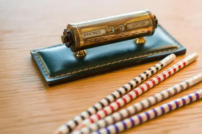 a wallet and two pencils on a table at Hotel 850 SVB, West Hollywood, a Member of Design Hotels in Los Angeles