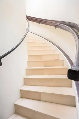 a staircase in a building with a glass railing at Entire Second Flr - Santa Monica Luxury Roman Villa in Los Angeles