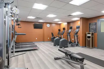 a gym with rows of treadmills and cardio machines at Candlewood Suites Anaheim - Resort Area by IHG in Anaheim