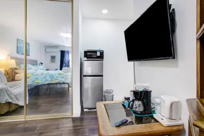 a living room with a tv on a wall at Beautiful House Fantastic view in Azusa in Azusa