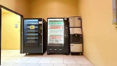 two soda machines are standing next to each other at Redondo Beach Inn-LAX in Gardena