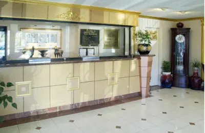 a restaurant with a counter and a clock in a room at Americas Best Value Inn & Suites - Fontana in Fontana