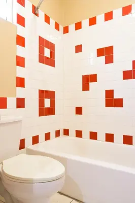 a bathroom with a white toilet and a tub at Covina Motel in West Covina