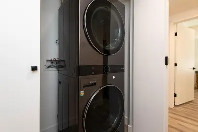 two washing machines stacked on top of each other at Regency Modern Apartments in Glendale