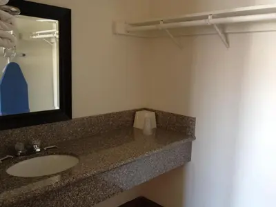 a bathroom with a sink and a mirror at Colton Inn in Colton