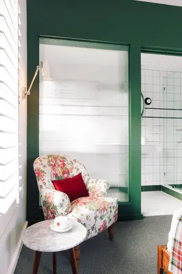 a living room with a chair and a table at Palihotel Culver City in Los Angeles