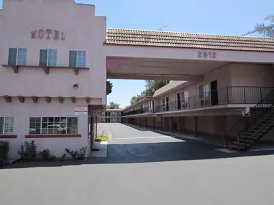 an empty street in front of a motel at Welcome Inn & Suites Anaheim in Anaheim