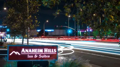 a sign on the side of a street at night at Motel 6 - Anaheim Hills, CA in Anaheim