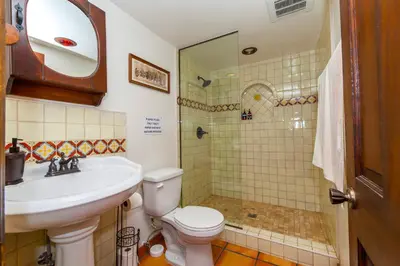 a bathroom with a toilet and a sink and a shower at Ocean View Casita in Los Angeles