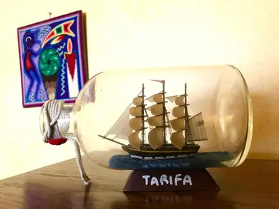 a small glass bottle with a pirate ship inside at Ocean View Casita in Los Angeles
