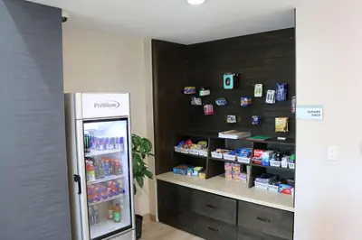 a grocery store with a refrigerator in a room at Best Western Plus New Barstow Inn & Suites in Barstow
