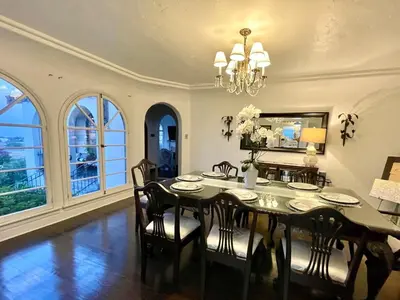 a dining room with a black table and chairs at SpanishFairytale4bd3ba in San Pedro