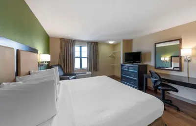 a hotel room with a bed and a desk at Extended Stay America Suites - Orange County - Katella Ave in Orange