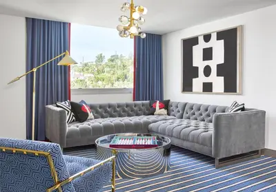 a living room with a couch and a table at Andaz West Hollywood, By Hyatt in Los Angeles